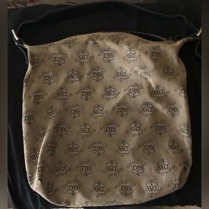 Dooney and Bourke canvas large hobo bag with adjustable leather shoulder strap.